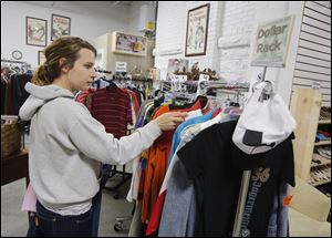 Courtney Aytes, 18, of Port Clinton shops at the Portage Resale Center. Ottawa County is among the areas where poverty has risen faster than in Toledo. 