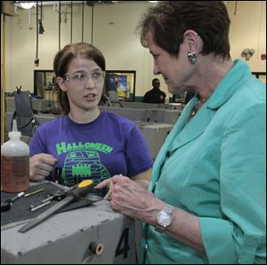 Sophomore Jessica Magrum talks to Fran Lawrence, executive vice president of the American Federation of Teachers. Leaders of the AFT, the Ohio Federation of Teachers, and a representative of U.S. Sen. Sherrod Brown toured the west end Toledo Technology Academy on Monday.