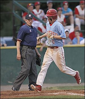 Bowsher's Braiden Greisiger scores in the first inning against Start.