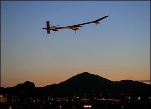 Solar Impulse, piloted by André Borschberg, takes flight during the second leg of the 2013 Across America mission, at dawn, today from Sky Harbor International Airport in Phoenix.