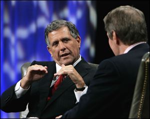 Leslie Moonves, left, president and chief executive officer of CBS, talks with PBS host Charlie Rose in Beverly Hills, Calif. Making $60.3 million in 2012, Moonves was the highest paid CEO of 2012.