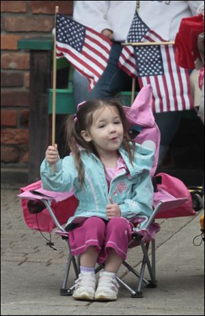 Samantha Gluza, 3, of Sylvania, along the parade route.