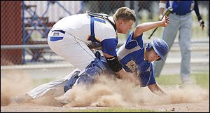 Northwood catcher Myles Habel tags out Delphos St. Johns pitcher Curtis Geise during the second inning in Hamler, Ohio. Northwood won 4-3.