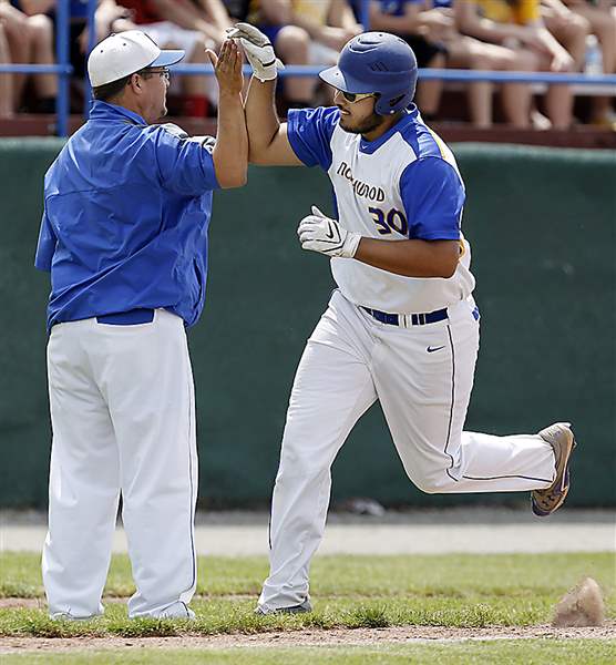 Northwood-s-Justin-Rohrs-is-congratulated-by-coach-Dave-Russell