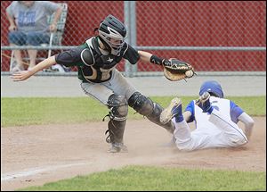 Northwood’s Jacob Davenport, slides in safely to score in the fourth inning before the tag by Tinora catcher  EJ Kissel. The Rangers finished the season 18-11.