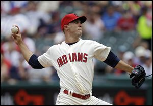 Cleveland Indians starting pitcher Ubaldo Jimenez delivers against the Tampa Bay Rays in the first inning today in Cleveland. 