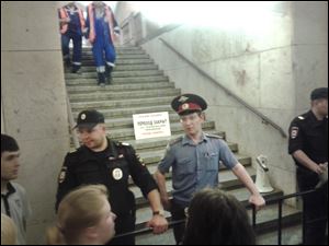 Police block a passage at a subway station in Moscow.