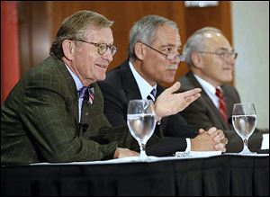 OSU President Gordon Gee, left, explains his decision to retire as board Chairman Robert Schottenstein, center, and Provost Joseph Alutto listen Wednesday.