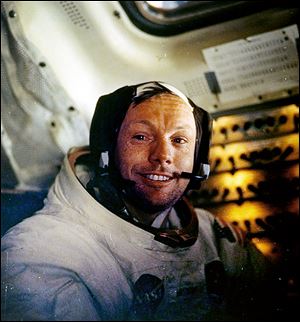 Neil Armstrong, shown in July 20, 1969, the first man on the moon, has never had a NASA facility named after him, but some in Congress want to change that. 