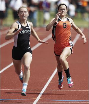 Gibsonburg's Colleen Reynolds, right, won the 400 meters and placed fifth in the 100 and 200 meters.