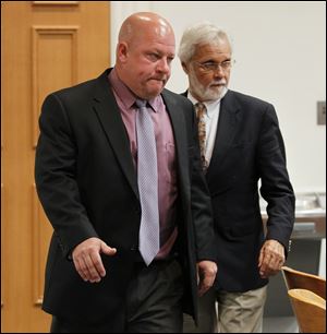 Oregon school board president P.J. Kapfhammer, left, appears in Maumee Municipal Court with attorney Jon Richardson.