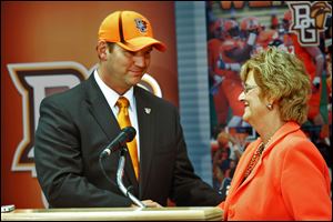 Chris Kingston, left, smiles as he is welcomed as the 13th director of athletics at Bowling Green State University by school president Mary Ellen Mazey. Kingston, who received a five-year contract with a base salary of $245,000 per year, will begin July 15.