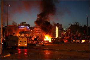 Fire from molotov cocktails and vehicle explosions burn Tuesday night as protesters in Istanbul clash with police in an attempt to re-take Taksim Square.