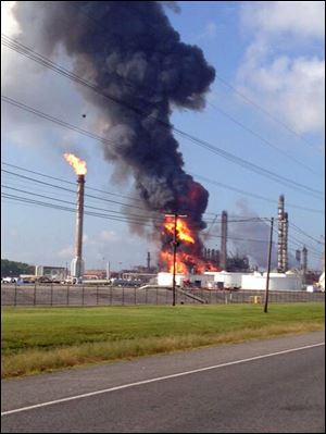 This photo provided by Ryan Meador shows an explosion at The Williams Companies Inc. plant in the Ascension Parish town of Geismar La., Thursday, June 13, 2013. The fire broke out Thursday morning at the plant, which the company's website says puts out about 1.3 billion pounds of ethylene and 90 million pounds of polymer grade propylene a year. (AP Photo/Ryan Meador) 