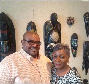 Darlene Roberts, right, poses with Odes Roberts, curator of the African Reflections Main Library exhibit.