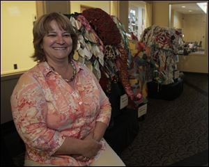 Jodi Russ, community librarian at the Bedford Public Library of the Monroe County Library System, says patrons love the elephant sculptures created by elementary students from across the county.