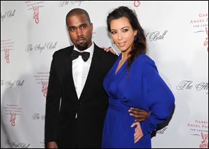 Kanye West and girlfriend Kim Kardashian attend a benefit in New York.