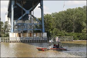 A Coast Guard boat searches the Maumee River for 18-month-old Elaina Steinfurth on Tuesday. She went missing from her east side home on June 2. 