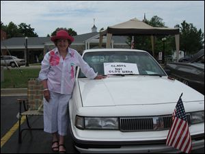 Mary Alice Powell with  Gladys, her 1991 Olds, at their first car show.