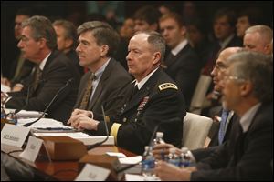 From left, Deputy Attorney General James Cole; National Security Agency Deputy Director Chris Inglis; NSA Director Gen. Keith B. Alexander; Deputy FBI Director Sean Joyce; and Robert Litt, general counsel to the Office of the Director of National Intelligence, prepare to testify on Capitol Hill today before the House Intelligence Committee hearing regarding NSA surveillance. 