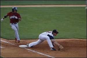 Lehigh Valley's Cesar Hernandez is outed at first base by Jordan Lennerton during game at Fifth Third Field Wednesday.