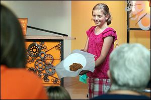 Michael Parrish, 7, of Toledo plays with ‘snot’ that he made during a program about the gross things the body produces with the author of ‘Grossology,’ Sylvia Branzei at Imagination Station.