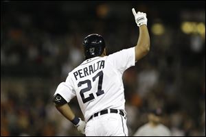 Detroit Tigers' Jhonny Peralta celebrates hitting a two-run walk off home run against Boston Red Sox relief pitcher Andrew Bailey in the ninth inning.