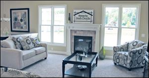 This comfortable great room includes a Craftsman-style fireplace.