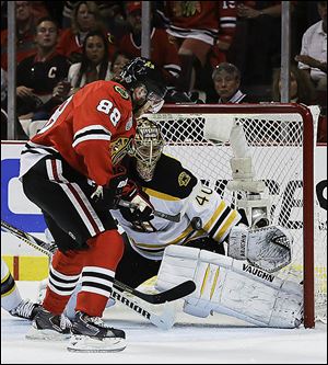 Chicago Blackhawks right wing Patrick Kane (88) scores against Boston Bruins goalie Tuukka Rask (40) in the second period during Game 5.