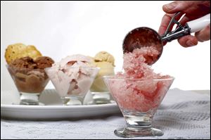 A watermelon granita, front, with chocolate, roasted strawberry, and pistachio ice cream.