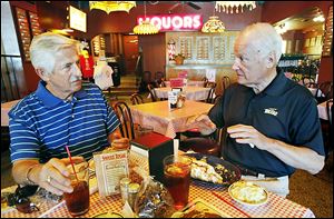 Longtime Toledoans Tom Walton, left, and Carty Finkbeiner talk about the city’s past, present, and future — and baseball.