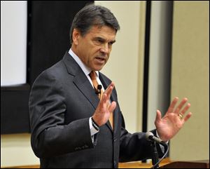 Texas Gov. Rick Perry, seen here in Connecticut last week, vowed today his state would push ahead to approve a ban on abortion after 20 weeks of pregnancy