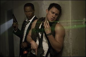 Jamie Foxx, left, and Channing Tatum in a scene from 