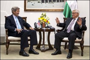 U.S. Secretary of State John Kerry, left, meets with Palestinian President Mahmoud Abbas inside Muqataa, the Palestinian Presidential compound in the West Bank town of Ramallah.