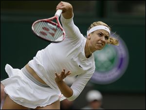 Sabine Lisicki of Germany serves to Serena Williams.