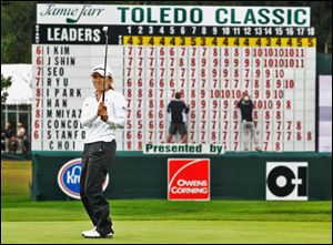 I.K. Kim reacts to missing a putt at the 18th green while volunteers post scores during the 2012 Jamie Farr Toledo Classic at Highland Meadows Golf Club. The LPGA  Tour returns for a 28th time this year to compete in the newly named Marathon Classic. 