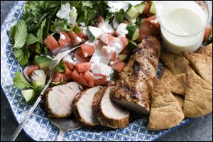 Ggrilled pork tenderloin with watermelon-arugula salad.