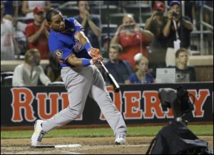 American League's Yoenis Cespedes, of the Oakland Athletics, hits his ninth home run in the third round to win the MLB All-Star baseball Home Run Derby.