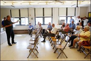 Central Elementary School's auction commences on the school property. The sale attracted about 45 people, including Sylvania Public Schools employees.