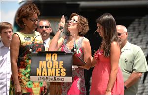 Stephen Barton, a survivor of the Aurora theater shooting, speaks during a pro-gun control Mayors Against Illegal Guns remembrance event honoring the victims of the Aurora theater shootings.