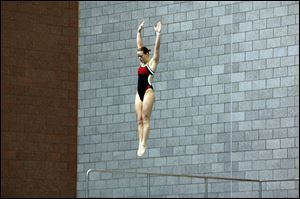 Cheyenne Cousineau, a Bedford High School graduate, prepares to dive in a meet for Ohio State University.