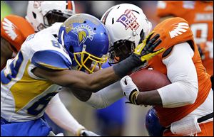 San Jose State's Chandler Jones tackles Bowling Green's Jerry Gates with a head-to-head collision in the Military Bowl. Helmet-to-helmet hits now are subject to a 15-yard penalty and ejection.