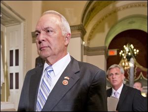 House Education Committee Chairman Rep. John Kline, R-Minn., left, followed by House Majority Whip Kevin McCarthy of Calif., helped get a bill passed to lower student college loan rates. 