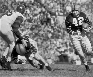 Dick Kazmaier carries the ball for Princeton in a 1951 game, the year the Maumee grad won the Heisman. 