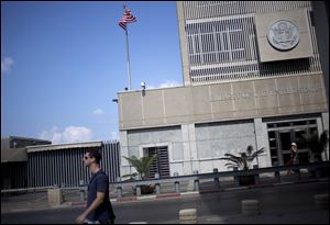 A ,man walks past the U.S Embassy in Tel Aviv, Israel,  today.