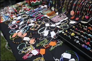 Rosemary Celestino of Gibsonburg displayed her handmade jewelry at last year's Perrysburg Heights Community Association's South of the Border Festival. The event has changed its formula and name to the Perrysburg Mexican-American Festival and will run from noon to midnight Saturday.