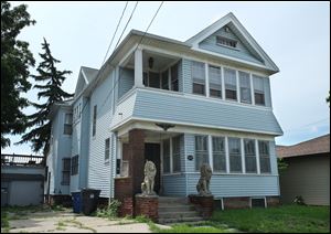 The late Martin Fewlas lived at 2557 Broadway while an upstairs apartment was occupied by Margaret McKnight, who along with two others are the focus of a federal probe into an alleged fraud on the Fewlas estate.