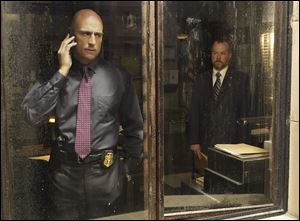 Mark Strong as Frank Agnew, left, and David Costabile as Simon Boyd in a scene from 