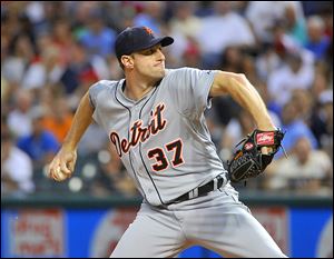 Tigers pitcher Max Scherzer delivers to Cleveland Indians batter Michael Bourn during the fifth inning of the Tigers' 10-3 victory at Progressive Field. Scherzer won his 17th game of the season.