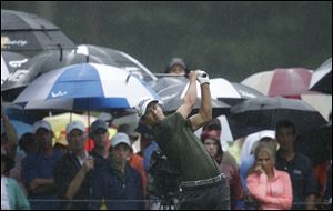 Adam Scott, of Australia, watches his tee shot on the 11th hole during the second round of the PGA Championship golf tournament at Oak Hill Country Club in Pittsford, N.Y. 